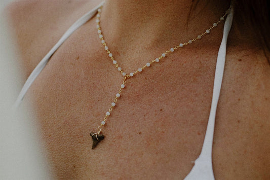 What Does a Shark Tooth Necklace Mean? (Symbolism + Why Everyone Is Wearing Them)
