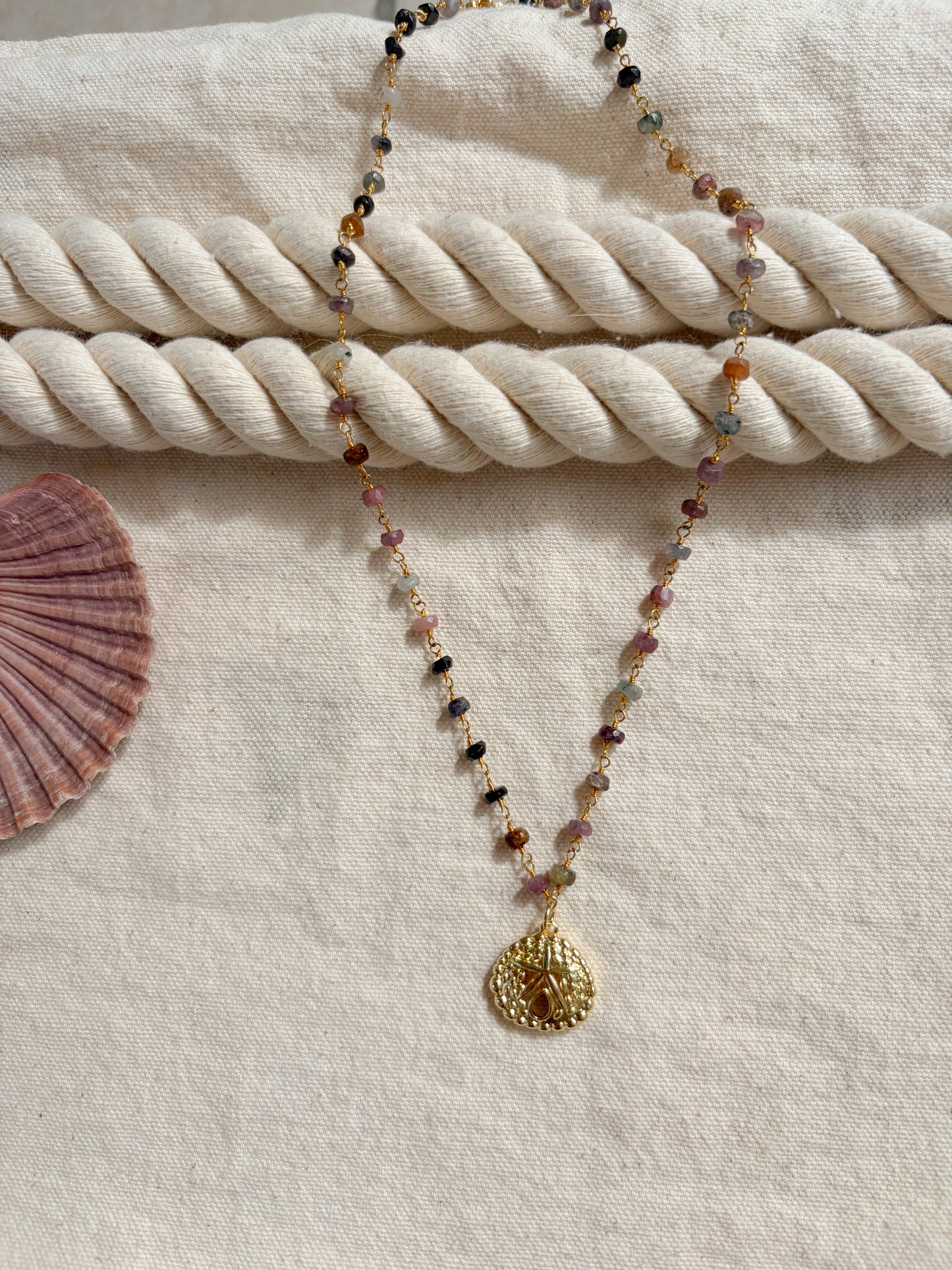 Deepwater Relic – Gold Sand Dollar Necklace (Tanzanite Beaded, 20”)