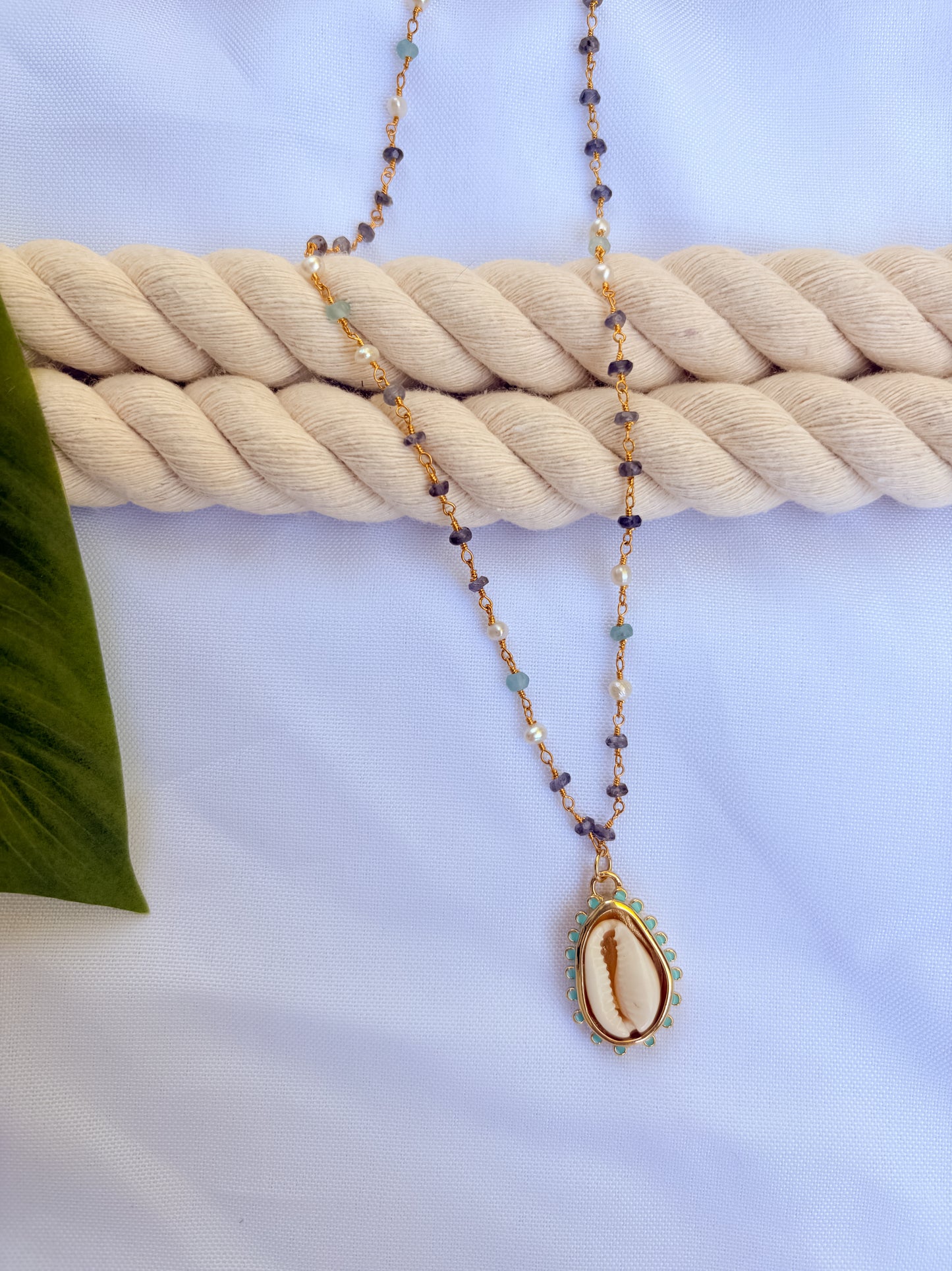 Maré Cowrie Necklace – Gold Beaded Aquamarine, Tanzanite & Cowrie Shell Pendant