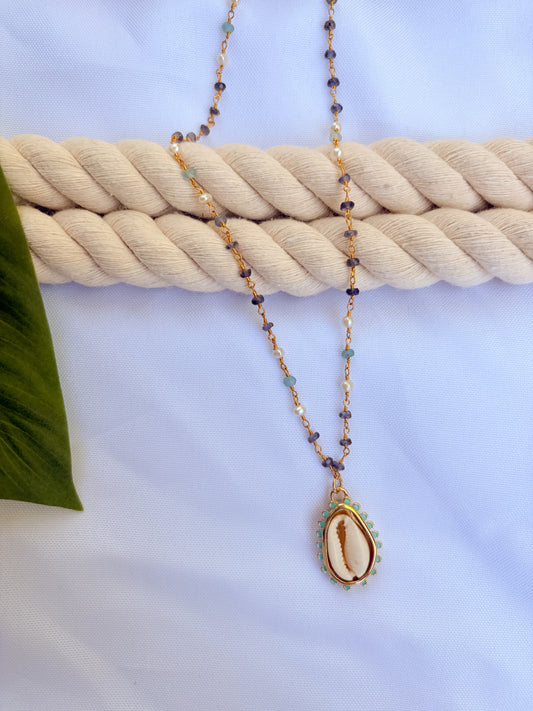 Maré Cowrie Necklace – Gold Beaded Aquamarine, Tanzanite & Cowrie Shell Pendant